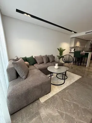 a living room with a couch and a table at Adresse exceptionnelle Casablanca in Casablanca