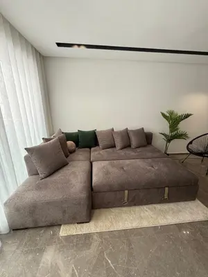 a brown couch in a living room at Adresse exceptionnelle Casablanca in Casablanca