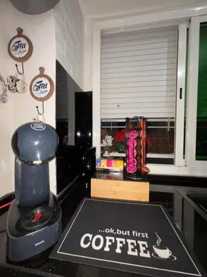 a coffee machine sitting on a counter with a coffee sign at Chez A&J, appartement climatisé, proche du Stade de Rabat in Temara