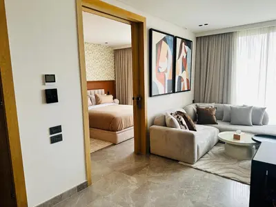 a living room with a couch and a bed at Premium Stay - Opale Seaside Beachfront in Anfa-Supérieur