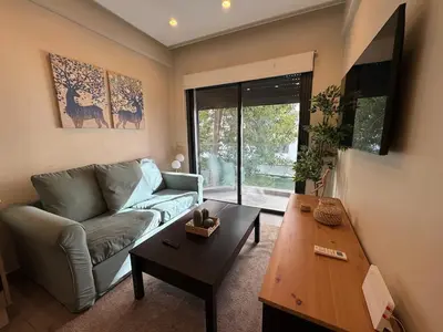 a living room with a couch and a coffee table at Studio en plein centre de Gautier in Casablanca
