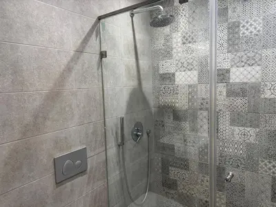 a shower in a bathroom with a glass door at Studio en plein centre de Gautier in Casablanca