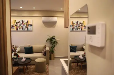 a living room with a couch and a table at Appartement à Gauthier, Casablanca in Casablanca