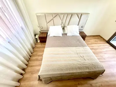 a bedroom with a large bed with two pillows at Hideaway Rosa Parc Mohammedia in Mohammedia