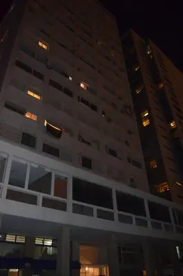 a tall building with several windows at night at Appartement Lilia in Casablanca