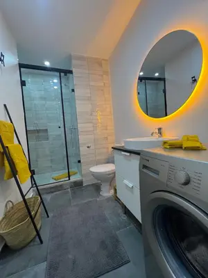 a bathroom with a washing machine and a sink at Stay IN GAUTHIER studio M in Casablanca