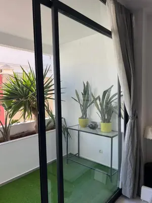 a room with potted plants and a glass door at Stay IN GAUTHIER studio M in Casablanca