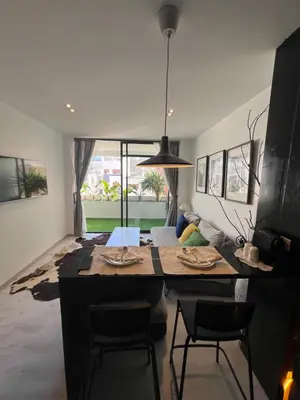 a kitchen with a table and chairs in a room at Stay IN GAUTHIER studio M in Casablanca