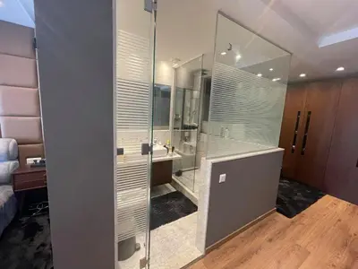 a bathroom with a glass shower and a sink at Très moderne 2 chambres 2 Salles de Bains in Casablanca