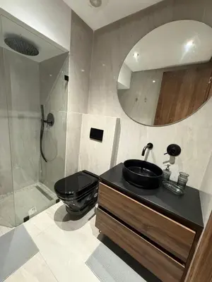 a bathroom with a sink and a toilet and a mirror at Adresse remarquable casablanca in Casablanca
