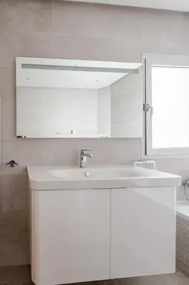 a bathroom with a white sink and a mirror at Villa Evasion Rabat Beach in Rabat
