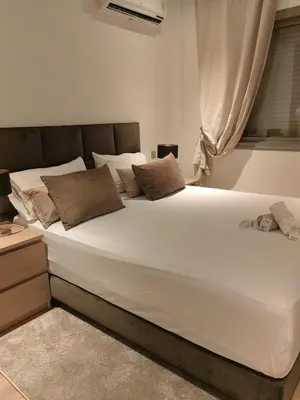 a large white bed in a room with a window at studio casa in Casablanca