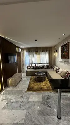 a large living room with a couch and a table at Luxurious Studio in Casablanca in Casablanca