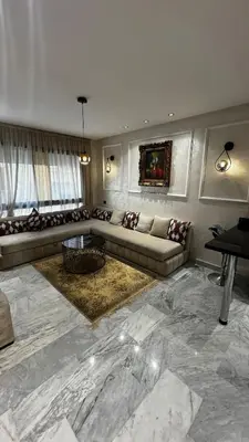 a living room with a couch and a table at Luxurious Studio in Casablanca in Casablanca