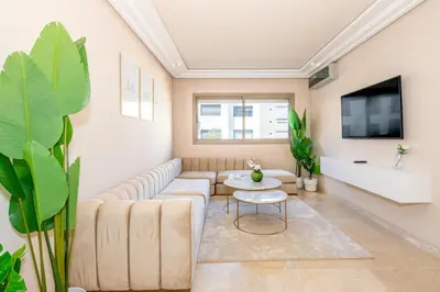 a living room with a couch and a table at Spacious & Central 3 bedrooms-Casablanca Center in Casablanca