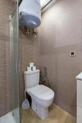 a bathroom with a white toilet and a shower at Spacious & Central 3 bedrooms-Casablanca Center in Casablanca