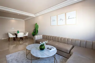 a living room with a couch and a table at Spacious & Central 3 bedrooms-Casablanca Center in Casablanca