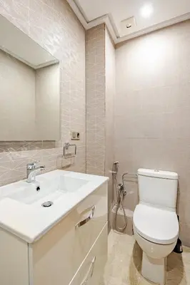 a bathroom with a white toilet and a sink at Spacious & Central 3 bedrooms-Casablanca Center in Casablanca