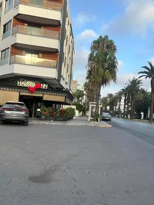 a car parked in front of a building at Riviera Escape - Appart Neuf Climatisé avec Balcon à Maarif Anfa in Casablanca