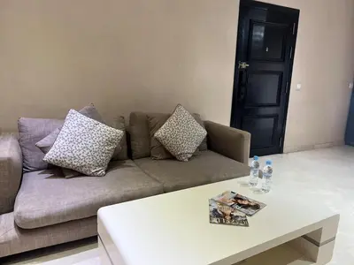 a living room with a couch and a coffee table at Beautiful, Bright and modern 3 bedroom apartment in Casablanca