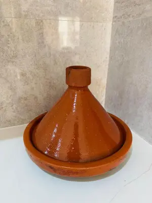 a brown vase sitting on top of a table at Urban square - comfortable, sunny, and fully equipped in Casablanca