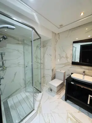 a bathroom with a shower and a toilet and a sink at Urban square - comfortable, sunny, and fully equipped in Casablanca