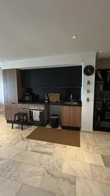 a living room with a large flat screen tv at Le Balcon du Port in Casablanca