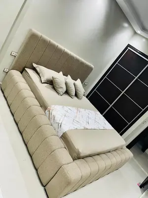 a couch with a bed in a room at L oasis cachée à deux pas de plage et piscine in Mohammedia