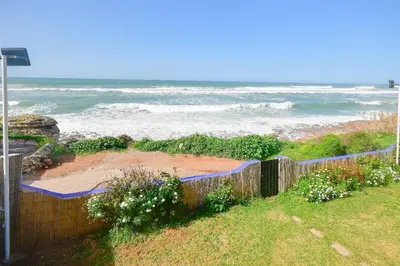 a view of the ocean from a yard at Grande villa luxueuse face à l'Océan in Temara