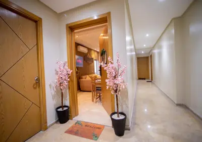 a hallway with two vases with flowers in it at R101-6- Lovely and Spatious apartments in Belvedere near High Speed Train Station in Casablanca