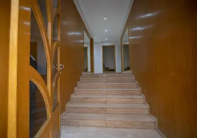 a hallway with wooden walls and stairs in a building at R101-6- Lovely and Spatious apartments in Belvedere near High Speed Train Station in Casablanca