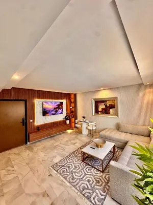 a living room with a couch and a table at Cozy apartment near the sea in Casablanca