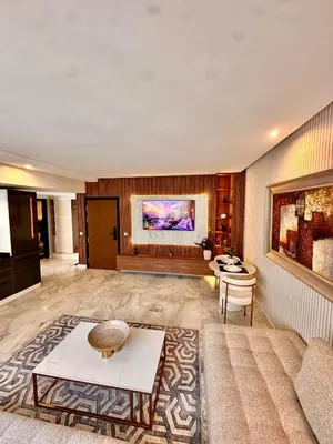 a living room with a couch and a table at Cozy apartment near the sea in Casablanca