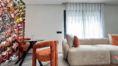 a living room with a couch and a table at Rooftop Pool Studio - By AppartAli in Casablanca