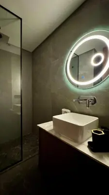 a bathroom with a sink and a mirror at Pool in the Sky - By AppartAli in Casablanca