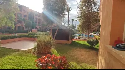 a view of a garden with a rainbow at Ricoflores Mansouria in Mansouria