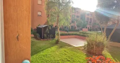 a view of a yard with a building at Ricoflores Mansouria in Mansouria