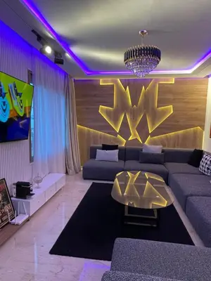 a living room with a couch and a table at Luxoria 2 californie in Casablanca
