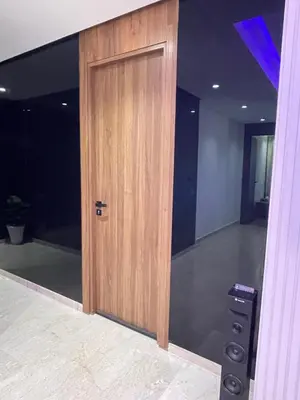 a room with a wooden door in a room at Luxoria 2 californie in Casablanca