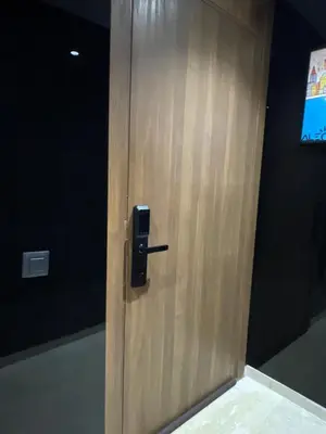 a wooden door with a handle in a room at Luxoria 2 californie in Casablanca