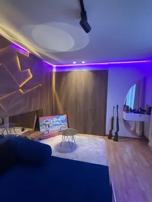 a living room with purple lights on the ceiling at Luxoria 2 californie in Casablanca
