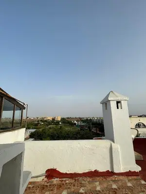 a small white building on top of a building at Apartment in a beachfront complex in Casablanca