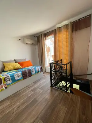 a bedroom with a bed and a window at Apartment in a beachfront complex in Casablanca