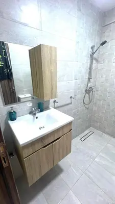 a bathroom with a sink and a shower at BOUZNIKA PLAGe in Bouznika