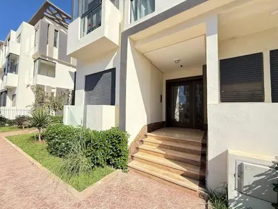 a house with a wooden staircase leading to a door at La Casa in Tamaris