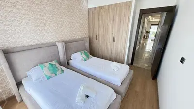 a hotel room with two beds and a doorway at La Casa in Tamaris