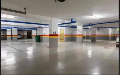 a large empty parking garage with columns and ceilings at La Casa in Tamaris