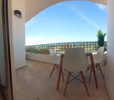 a dining room with a view of the ocean at Appartamento Narjis in Casablanca