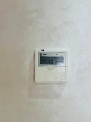 a clock is hanging on a wall at Elegant & Cozy Beach Apartment in Mohammedia