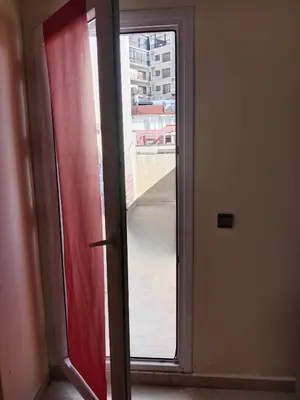 a sliding glass door with a view of a building at Résidence journalière chic Casablanca in Casablanca